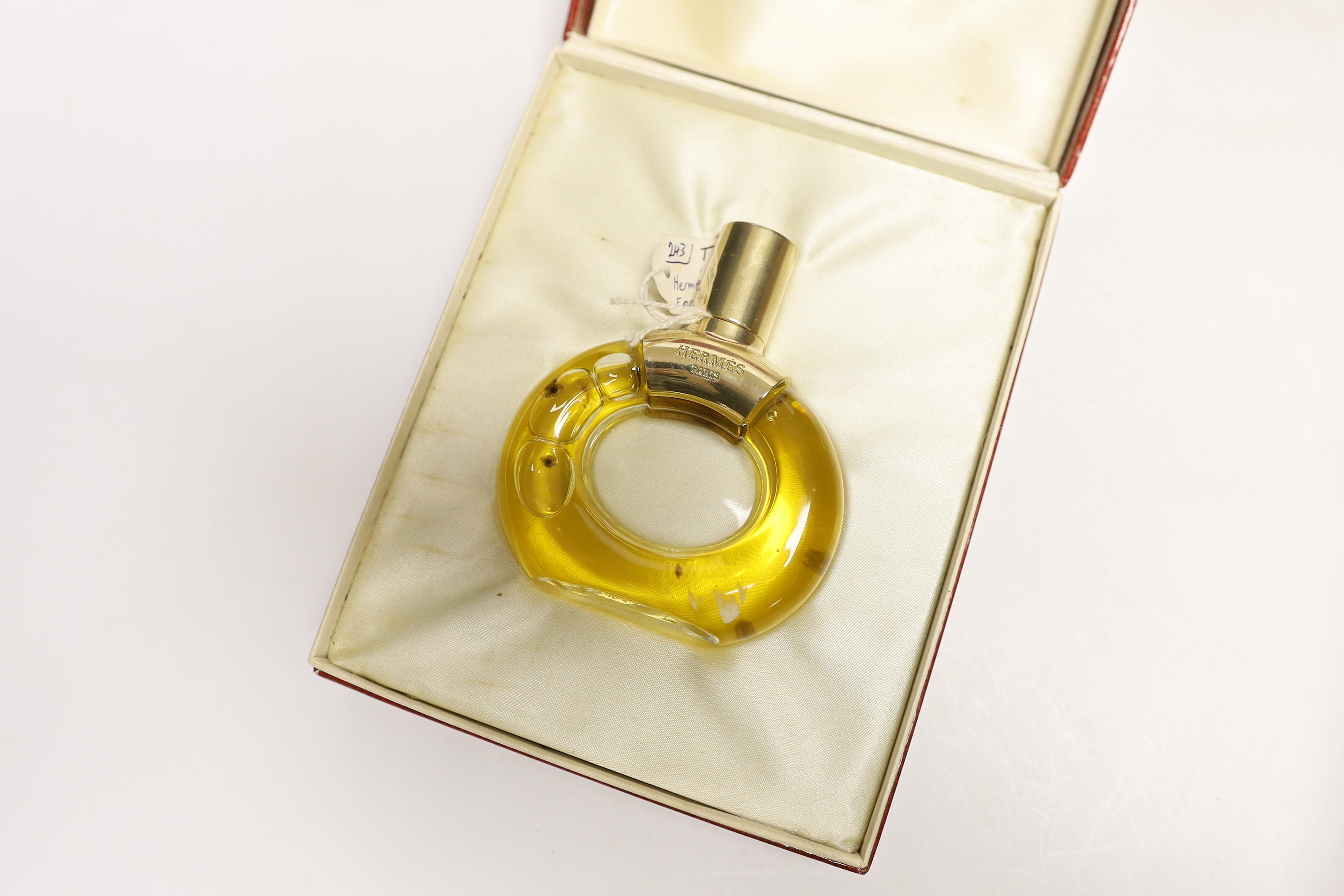 Four bottles of Cartier ‘Panthere’ perfume (three boxed boxed) plus a small bottle of Cartier eat de toilette, and a boxed bottle of Hermes, Paris perfume.